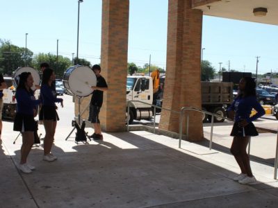 The RL Turner cheerleaders and drum line welcomed the guests for the celebration.