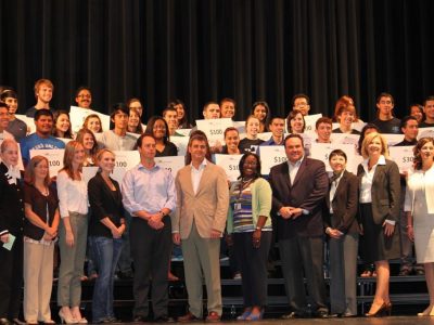 LBJ Express and NMSI leaders join R.L. Turner students and educators to celebrate AP test results. Students received $100 for each AP test they passed.