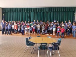 LBJ volunteers with 140 middle school students