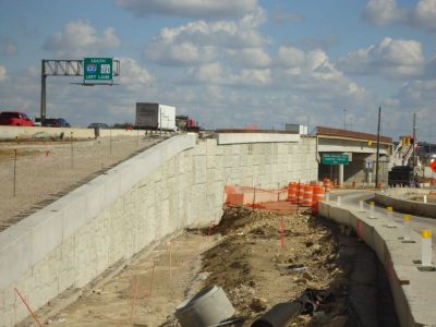 March 2013: Retaining walls on eastbound IH 820 frontage road near Holiday Lane