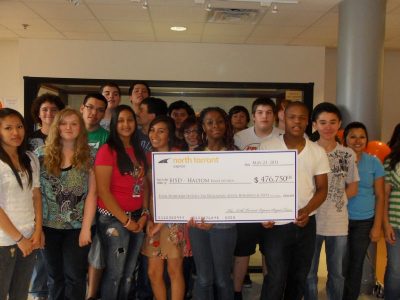 Haltom High School AP students accept grant check