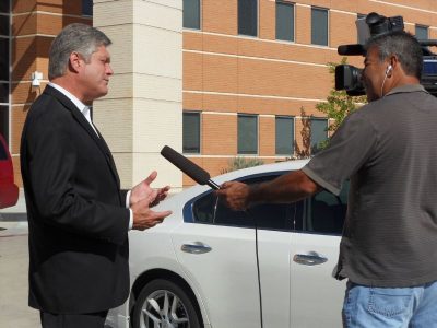 NTE Corporate Affairs Director Robert Hinkle talks with the media about the new AP math and science program at Haltom High