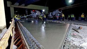 Crews finish pouring the final bridge deck over Big Fossil Creek and I-820.